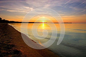 Sunset on the shore of a Minnesotan lake. photo