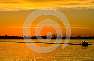Sunset with the silhouette of a boat on the inter coastal in Belleair Bluffs, FloridaSunset with the silhouette of a boat on the i