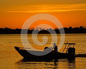 Sunset with the silhouette of a boat on the inter coastal in Belleair Bluffs, FloridaSunset with the silhouette of a boat on the i