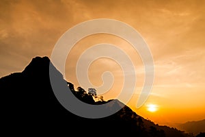 Sunset in the silhouette mountains