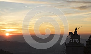 Sunset silhouette of sculpture of St Longinus in famous sanctuary