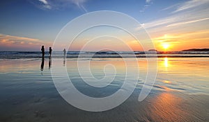 Sunset and silhouettes at the beach