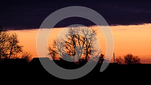 Sunset. Silhouettes of houses