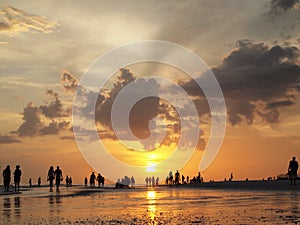 people walking beach