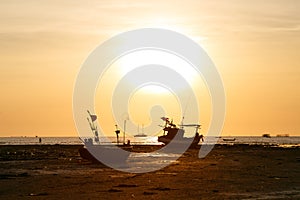 Sunset and siluate boat photo
