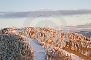 Sunset on ski slopes at winter