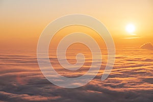 Sunset sky above clouds, dramatic sunset sky. Nature background, aerial view.