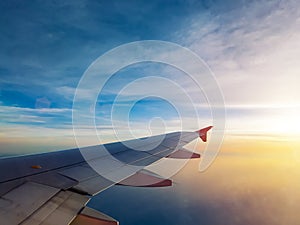 Sunset sky as seen through window of airplane, plane window. travel and vacation concept.