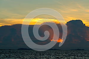 sunset sky back on dark silhouette cloud red lava hole of sun ray last light