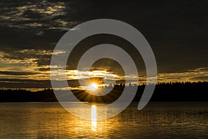 Sunset sky background. Dramatic gold sunset sky with evening sky clouds over the sea. Stunning sky clouds in the sunset. Sky