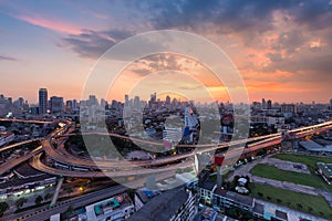 Sunset sky background over Bangkok city and highway interchanged, Thailand