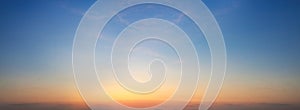 Sunset sky background. Panoramic view of sunset sky.