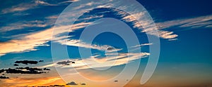 Sunset sky. Cirrocumulus and cirrostratus clouds during sunset. Beautiful dramatic sunset sky background.