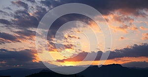 Sunset. Sky clouds background. Ridge Mountains silhouette. Skyline. Montenegro