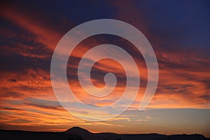 Sunset. Sky clouds background. Ridge Mountains silhouette. Skyline. Montenegro