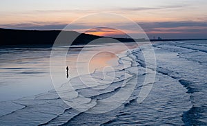 Sunset Sky with clouds over sea sand beach with ocean wave in evening Summer,Landscape by Seaside with Colourful Sky in Orange,