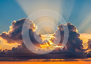 Sunset sky with dramatic clouds and sun rays streaming through.