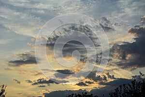 Sunset sky in the evening with light and dark clouds