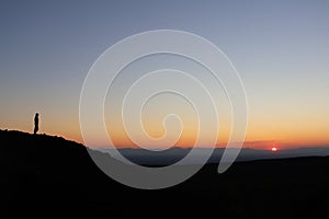 Sunset sky and Kamchatka mountains in the clouds