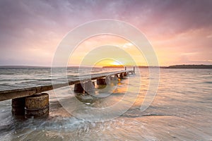 Sunset sky and long timber jetty