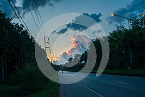 Sunset sky with motorcycles on trang-palian road