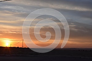 Sunset sky over the Arar settlement in the Negev desert, Israel photo