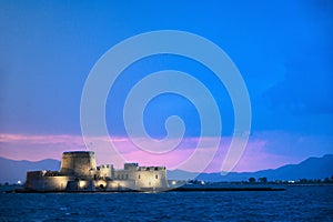 Sunset sky over Bourtzi water fortress in Nafplio, Greece photo