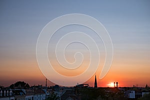 Sunset sky over city , colorful sky panorama over rooftops