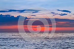 After sunset sky over sea coast skyline