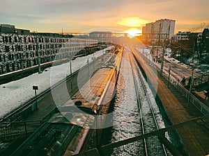 sunset sky over the train station and railway in city