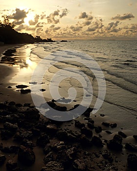 Sunset sky reflected on sea beach in summer time