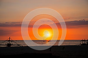 Sunset sky and sea landscape with wooden boat. Romantic seascape on tropical island. Summer vacation travel card