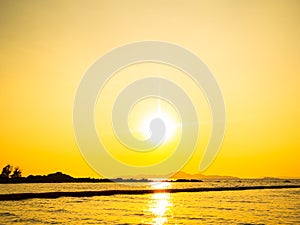 Sunset Sky with Sea Ocean Background Golden Cloud Horizon Sunrise on Sand Beach and Calm Water Nature,Yellow Sunlight Down