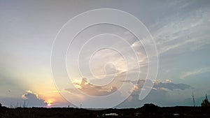 Sunset sky silhouete field photo