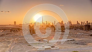 Sunset with skyline of Downtown Dubai in the evening timelapse.