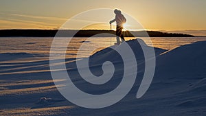 A Sunset Snowshoe hike on a Frozen Lake