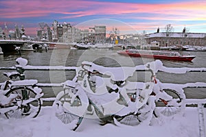 Sunset in snowy Amsterdam in the Netherlands at the Amstel