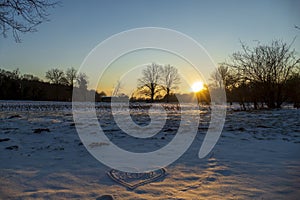 Sunset on a snowy meadow near Baden-Baden