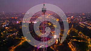 Sunset Spectacle Aerial Views of Milan Cityscape with Branca Tower. Drone flying at night