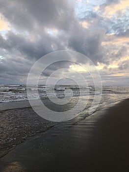 Sunset in Spring at Black Sand Beach in Kekaha on Kauai Island, Hawaii - Niihau Island in Horizon.