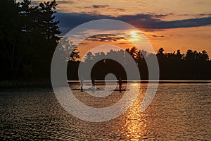 Sunset with 3 standup paddeling board on the Des milles Iles river Laval photo