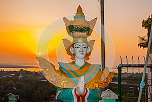 Sunset. Statue. Kyaik Tan Lan .The Old Moulmein pagoda. Mawlamyine, Myanmar. Burma.