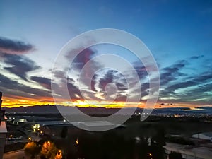 Sunset with storm clouds over mountains