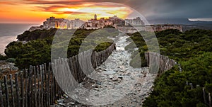 Sunset and storm over the Old Town of Bonifacio, the limestone cliff