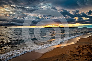 Sunset on a stormy day at Dongtan Beach, near Pattaya, Thailand