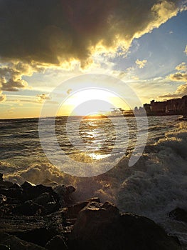 Sunset on the stormy sea in Genoa Pegli: the power of the sea photo
