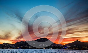 Sunset with a stunning beautiful sky above the city of Cabo San Lucas. Mexico. Sea of Cortez.