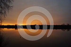 Sunset, sun light, pond and calm water