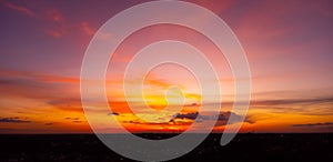 Sunset and sunrise.Panorama silhouette tree in africa with sunset.Dark tree on open field dramatic sunrise.