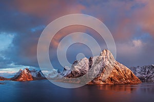 Sunset or sunrise panoramic view on stunning mountains in Lofoten islands, Norway, Mountain coast landscape, Arctic circle.